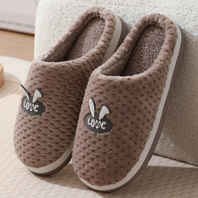 Rabbit plaid design women's house slippers in artificial fur with a flat heel and rubber sole.
