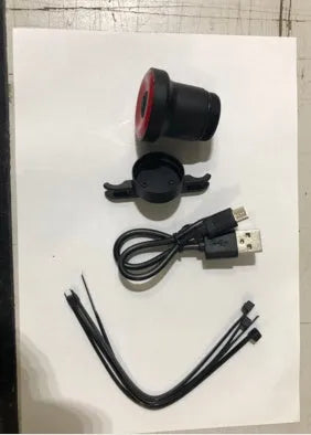 ENFITNIX Xlite100 bicycle taillight with 6061 aluminium chassis, mounted on seat rail, black body with red lens