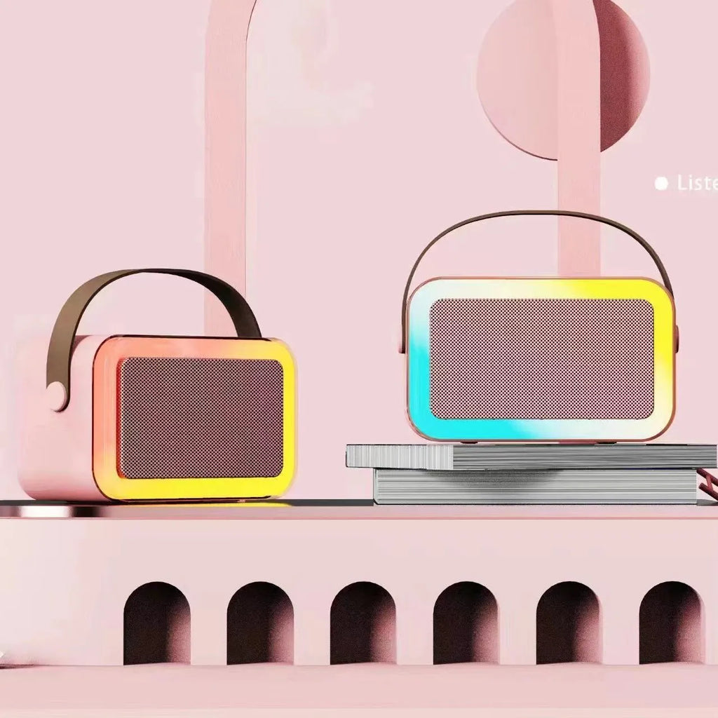 Portable Bluetooth speaker with microphone and coloured LED lights in pink, sky blue, or white.