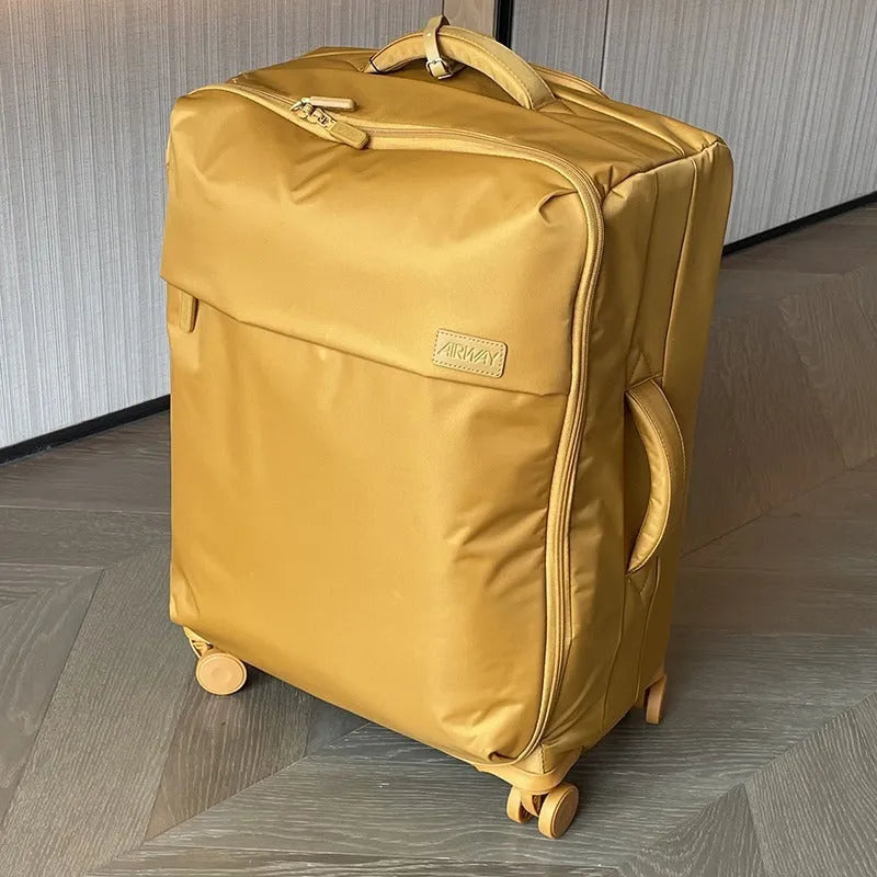 Ultra-light waterproof Oxford cloth suitcase with universal wheels in bluestone green colour.