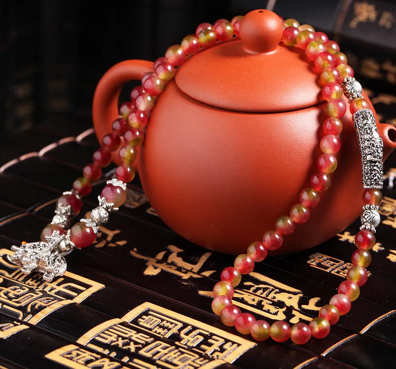 Handcrafted natural watermelon crystal bracelet with geometric beads and Chinese knot adjustable closure