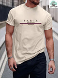 Man wearing a heavy loose-fit pure cotton T-shirt with a letter print on the chest in a casual setting.