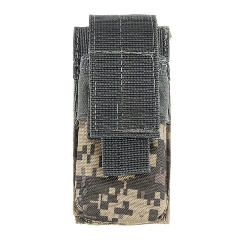 Black tactical molle waist bag for pistol cartridges or a small flashlight, showing elastic cord buckle.