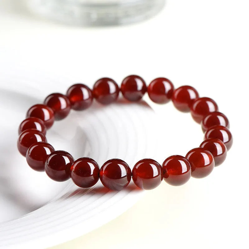 Natural orange red garnet crystal ball bracelet with retro Ruyi design and unisex styling