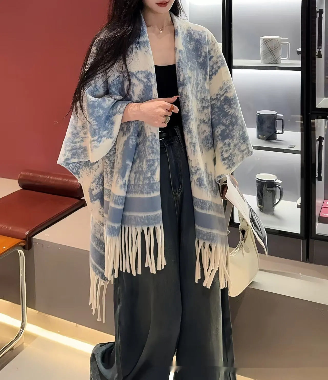 Women's polyester scarf cape with tassel edges in shawl style, shown in one of five available colours
