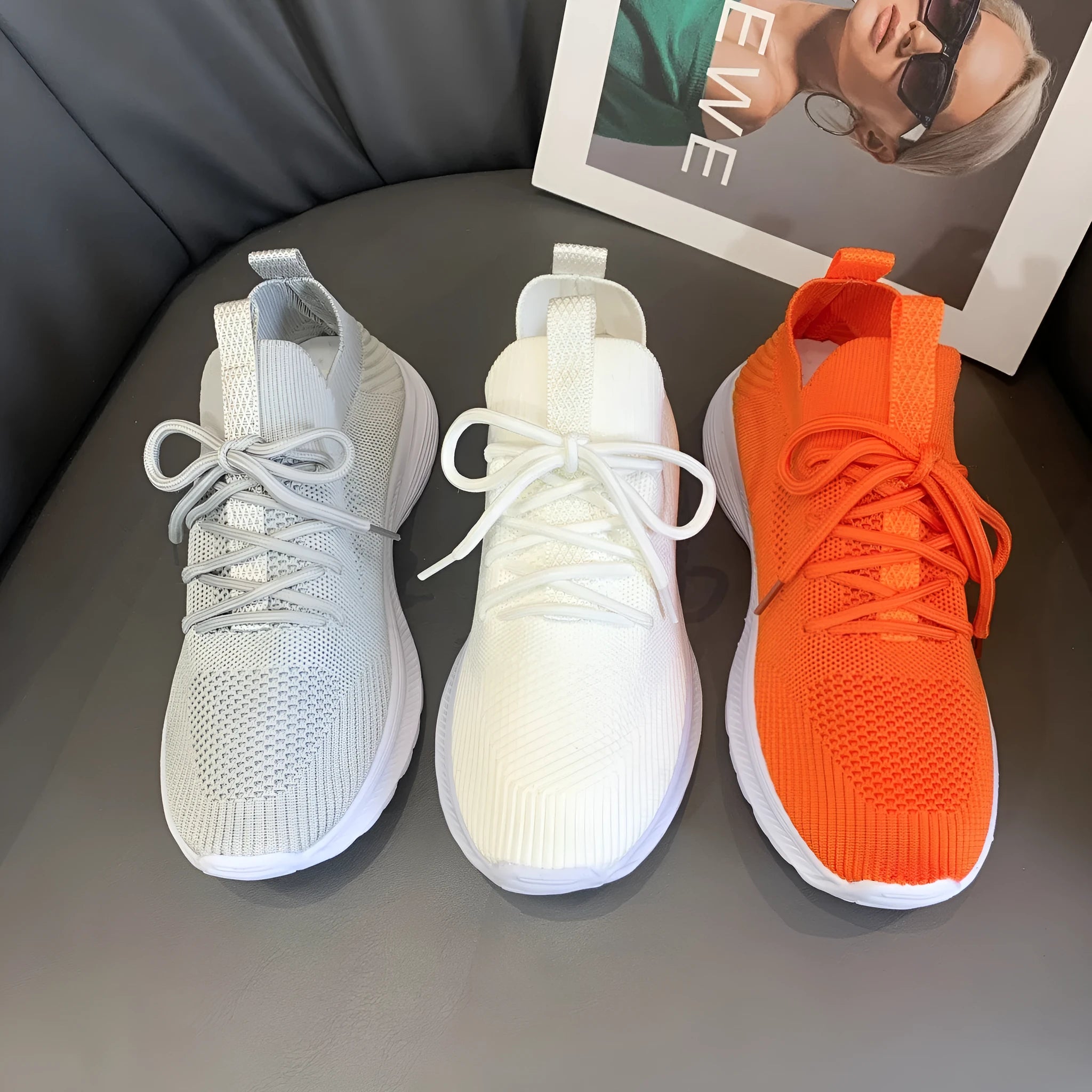 Women's creamy white Flyknit running shoes with mesh lining and low-top design on a rubber sole