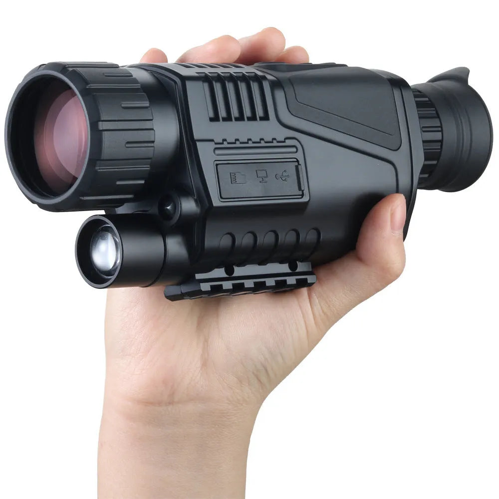 Compact black infrared digital night vision telescope with 40mm lens on a table with its storage bag and cables.