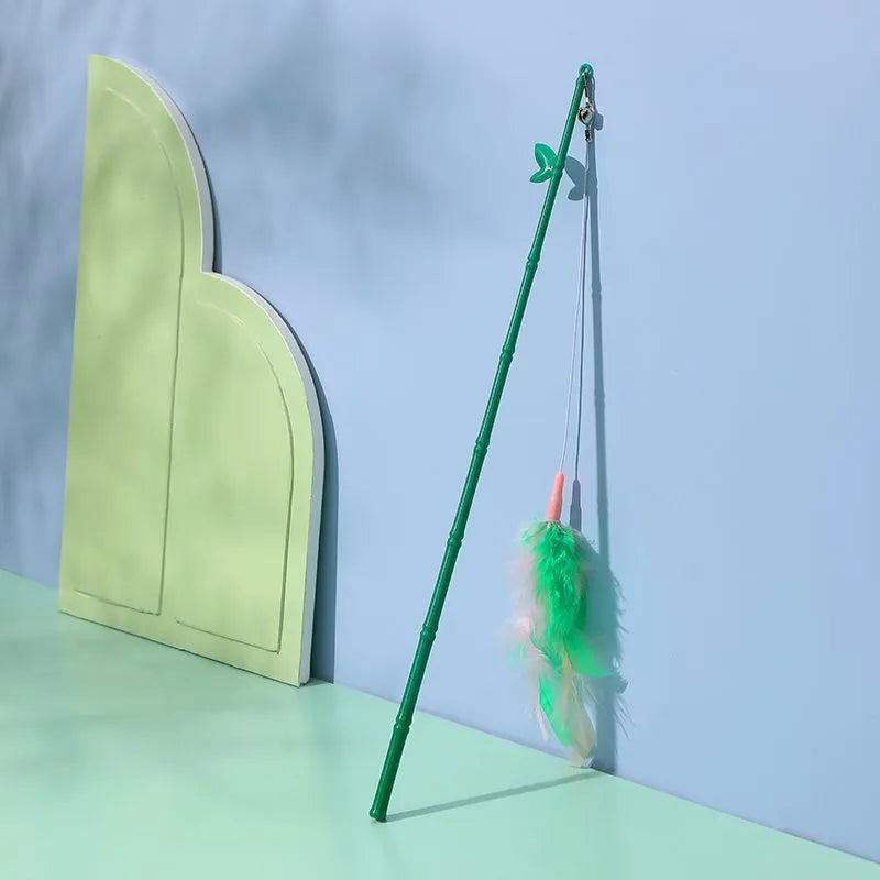 Green interactive cat feather wand toy with bells and synthetic feather attachments