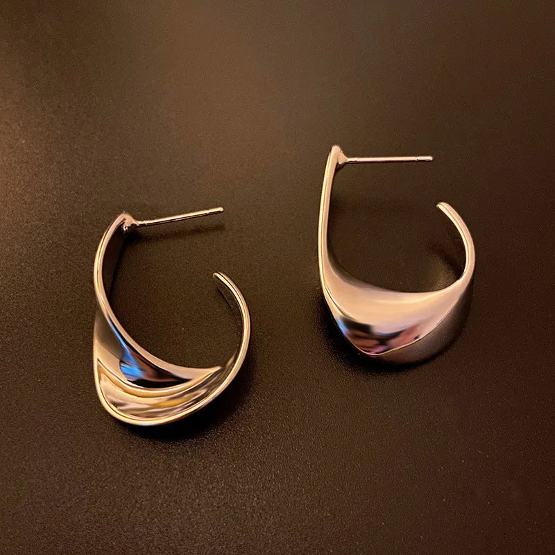 Twisted geometric metal earrings with electroplated gold or silver finish
