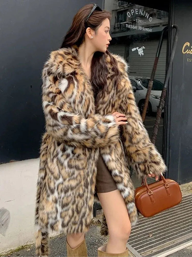 Faux fur coat with fur collar in long or mid-length style showing pocket details