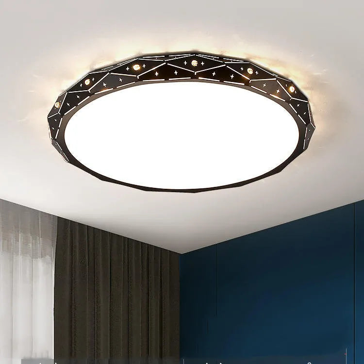 Round black and white framed LED ceiling light fixture for room installation.