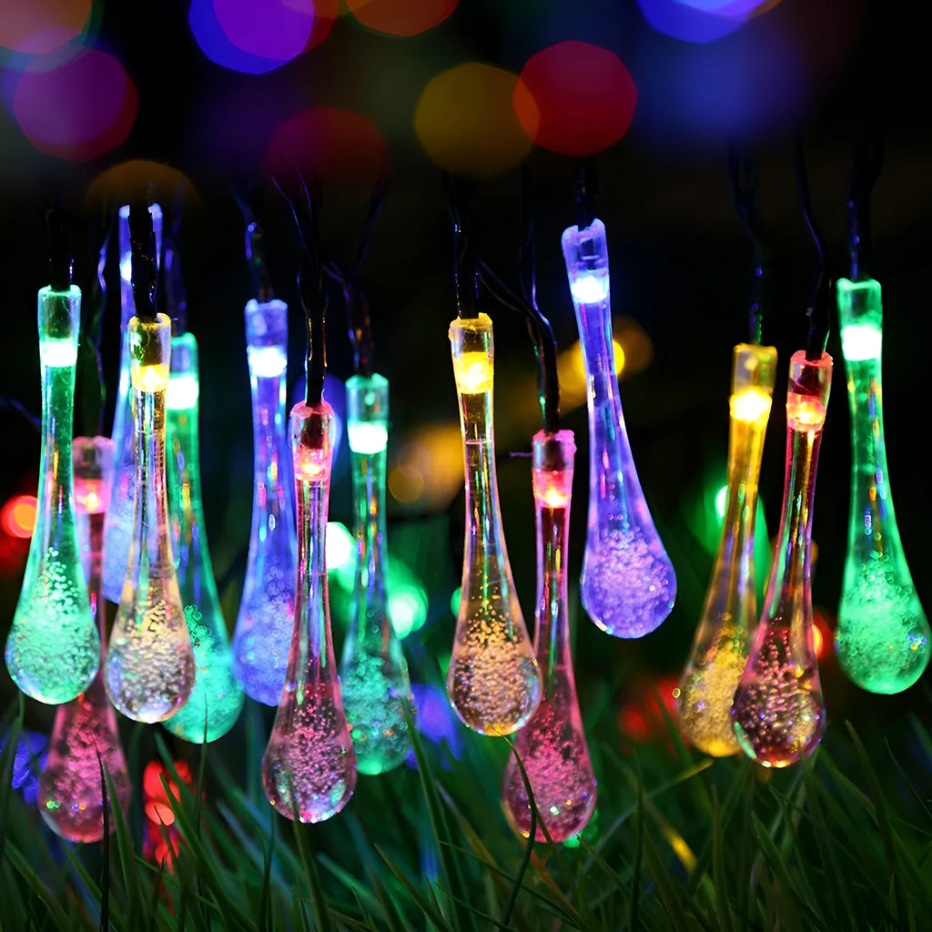 Solar-powered LED Water Drops string lights with ABS plastic pendants on a 6.5 metre wire for outdoor gardens.