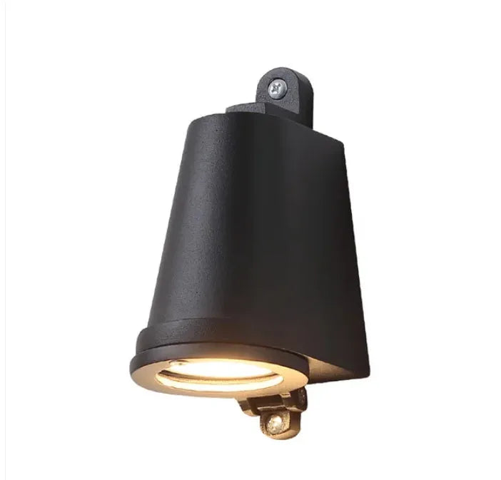 Industrial cast aluminum horseshoe wall lamp in sand black finish for outdoor door.