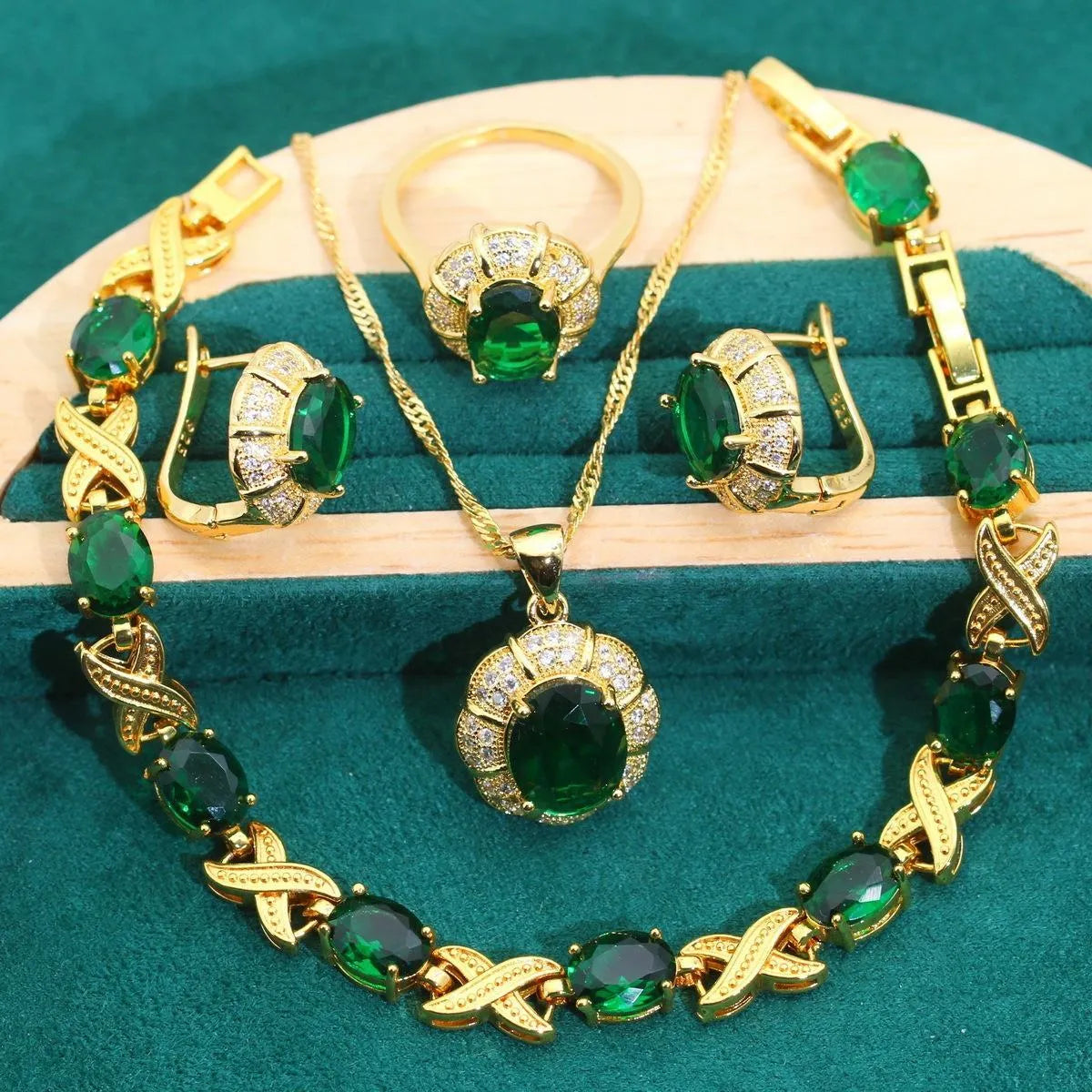 18k gold plated zircon jewellery set showing necklace, earrings, ring, and bracelet with synthetic cubic zirconia stones