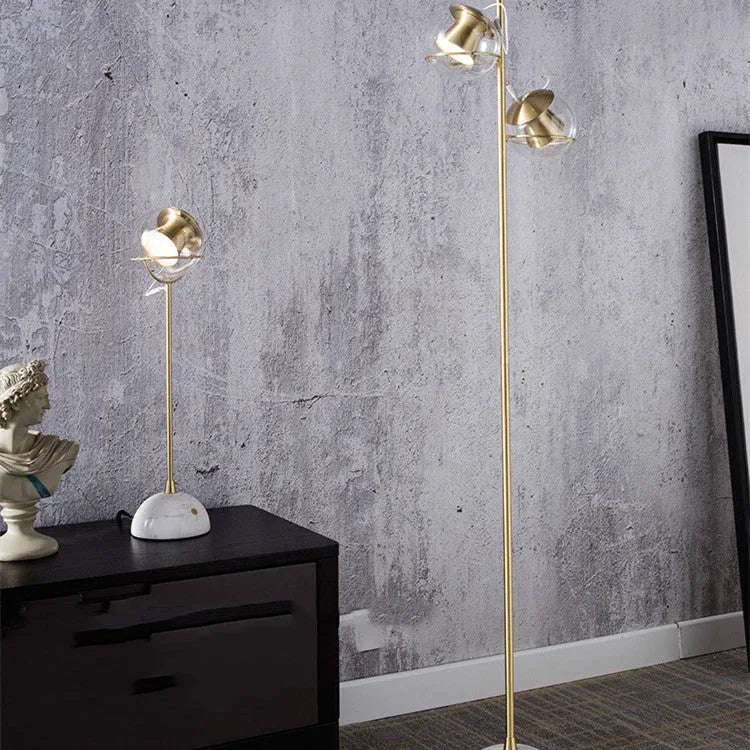 Clear glass desk lamp with dimmable LED light and touch switch on base.