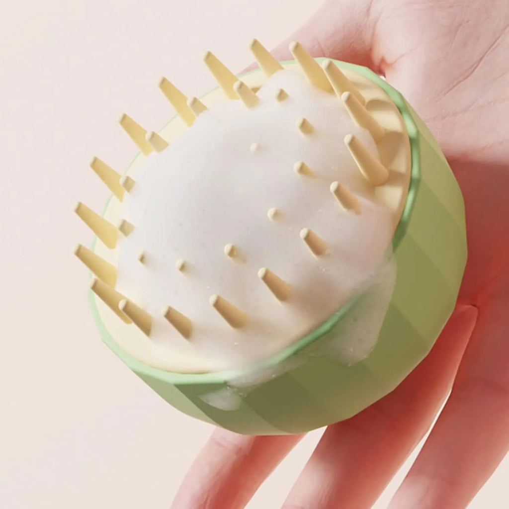 Green pet bath massage brush with soft silicone bristles and drainage holes for dogs and cats
