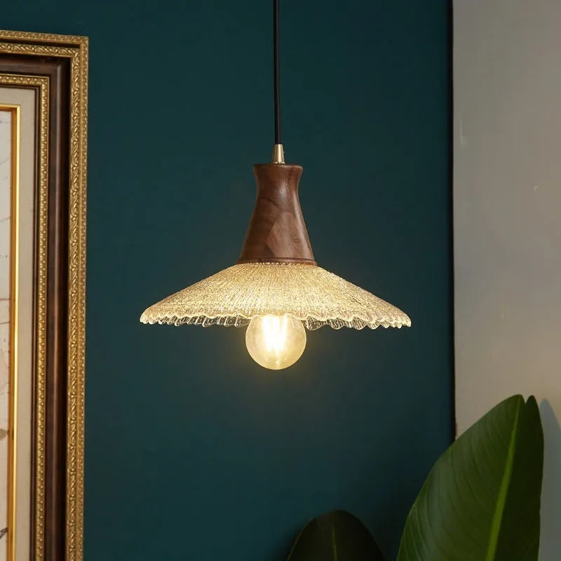 Retro-style brass and glass chandelier with wood body for ceiling mounting in restaurants.