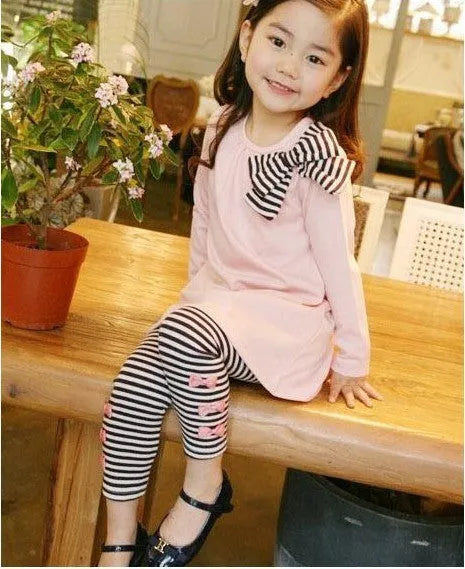 A pink two-piece cotton clothing set for a young girl, shown in sizes 110cm to 140cm.