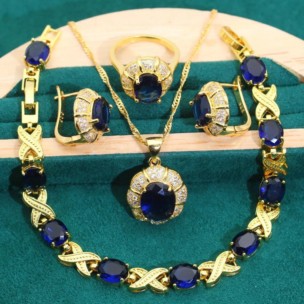 18k gold plated zircon jewellery set showing necklace, earrings, ring, and bracelet with synthetic cubic zirconia stones