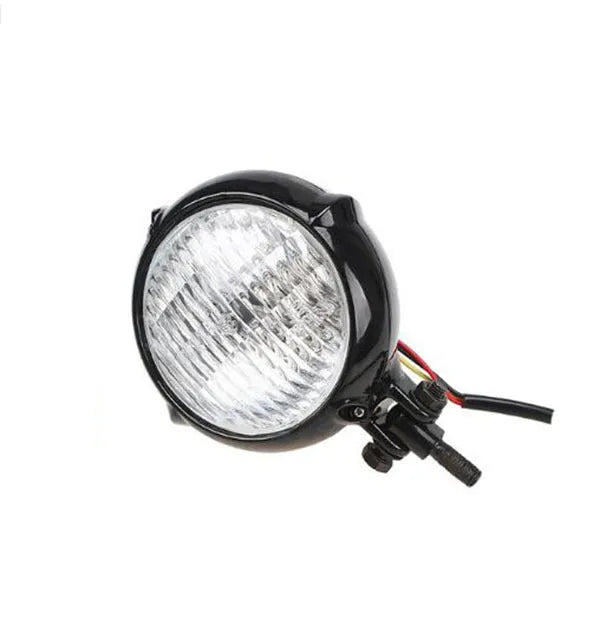 Retro-style black electroplated aluminium Harley headlamp with 8cm diameter and yellow halogen bulb