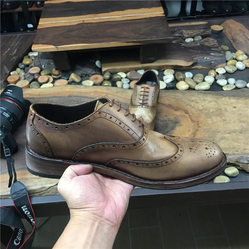 Light brown men's vintage engraved leather casual shoes with distressed finish and lace-up closure.
