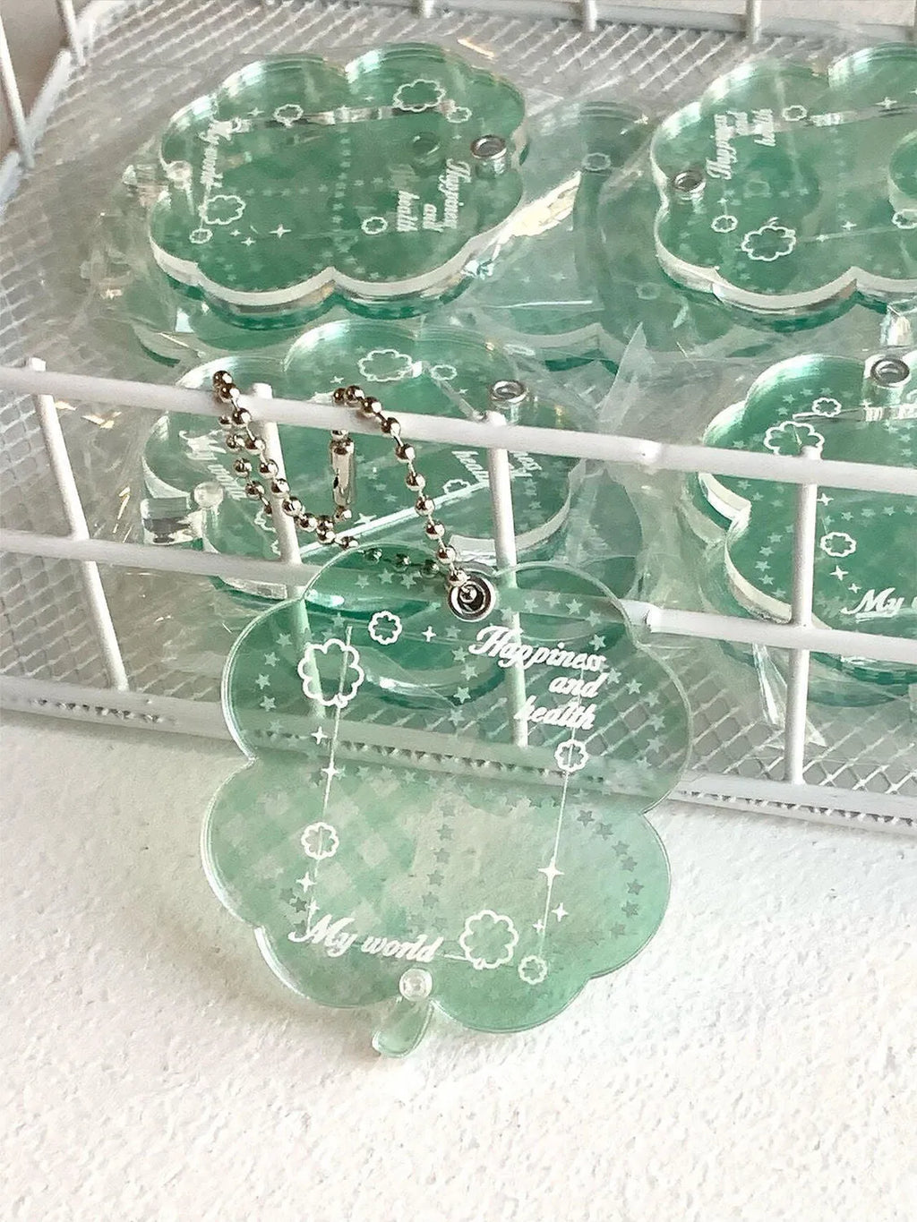 Acrylic four-leaf clover pendant keychain in elegant blue, grass green, or mint green.