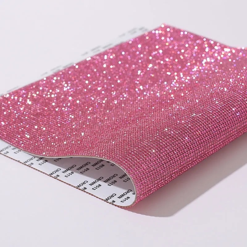 Rhinestone sticker sheet with hot drill glue backing showing eight-eye pattern stones in multiple colours