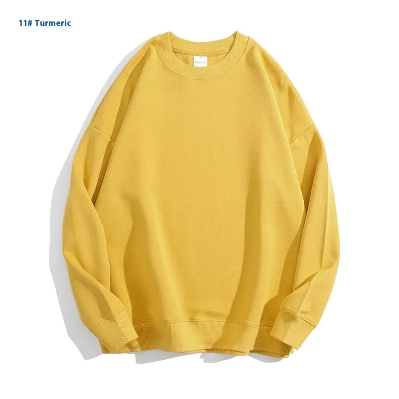 A loose-fitting, off shoulder, round neck cotton sweater in a solid colour with long sleeves.