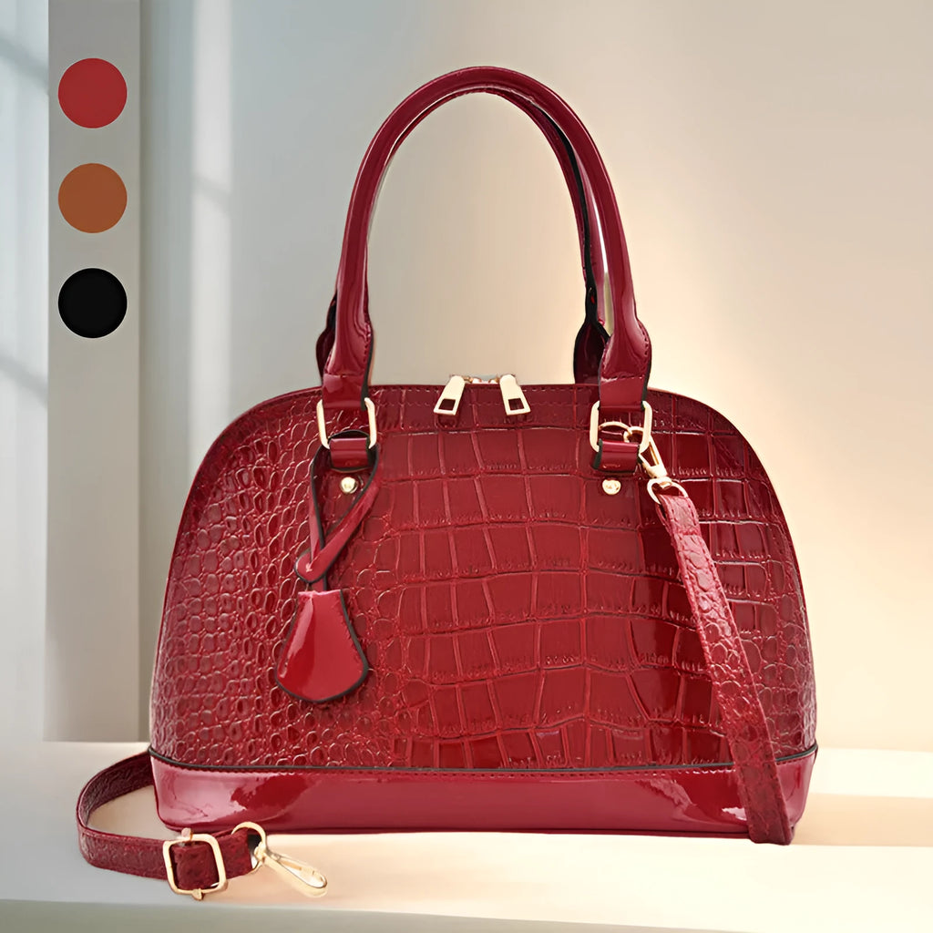 Shiny PU leather crossbody shoulder bag in structured shell shape design showing black colour option