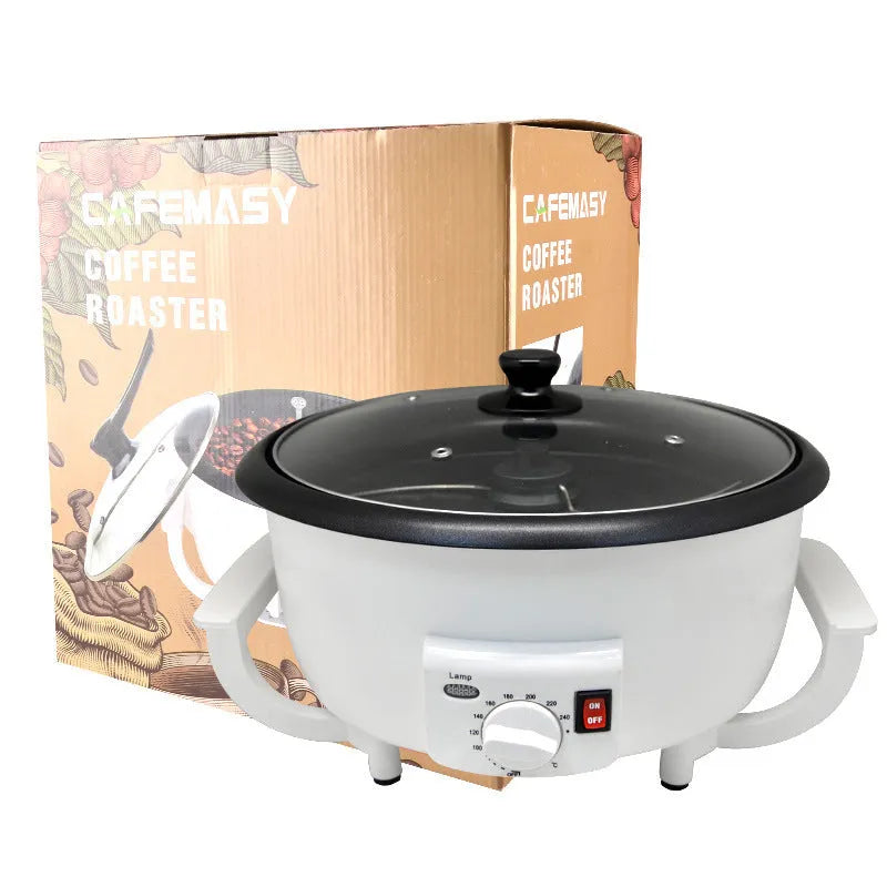 White electric coffee bean roasting machine with 750g capacity and oblate drum design on kitchen counter