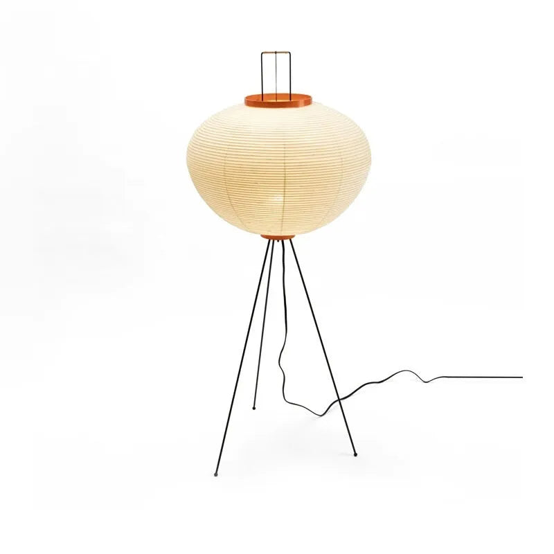 Japanese style rice paper table lamp with aluminium body and decorative shade on wooden surface