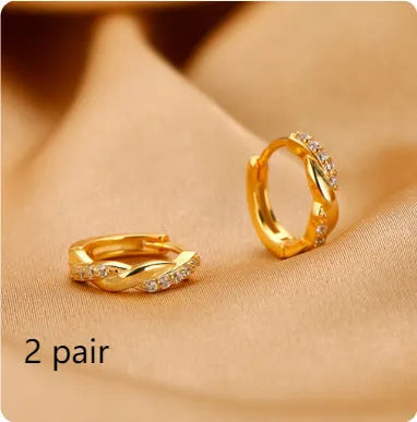 Interwoven hemp rope earrings with geometrical round shape in gold and silver colours
