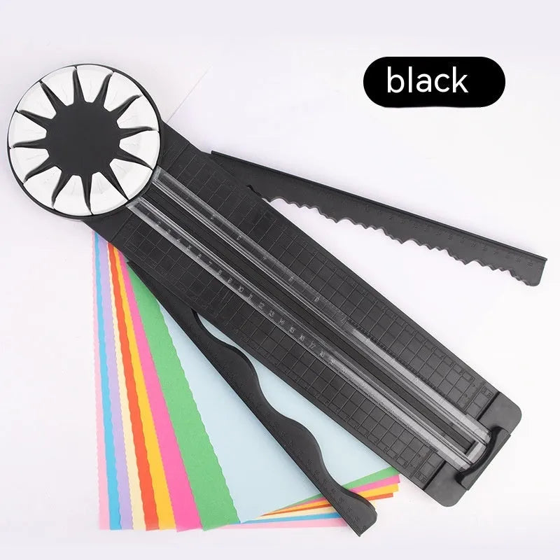 Pink and black plastic paper cutting machine with 12 patterns on desktop