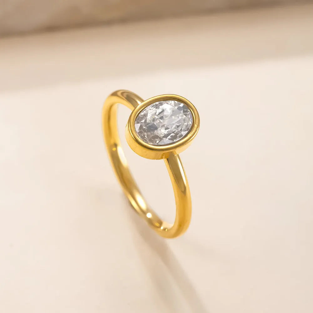 Stainless steel ring with oval zircon stone in geometric shape, unisex, available in steel and gold colours