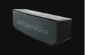 Black BS-6 cloud smart speaker showing compact rectangular design and micro-USB port.