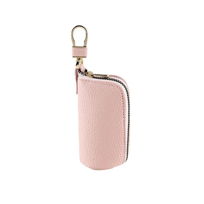 Men's black PU leather zipper key ring organiser case on a grey background.