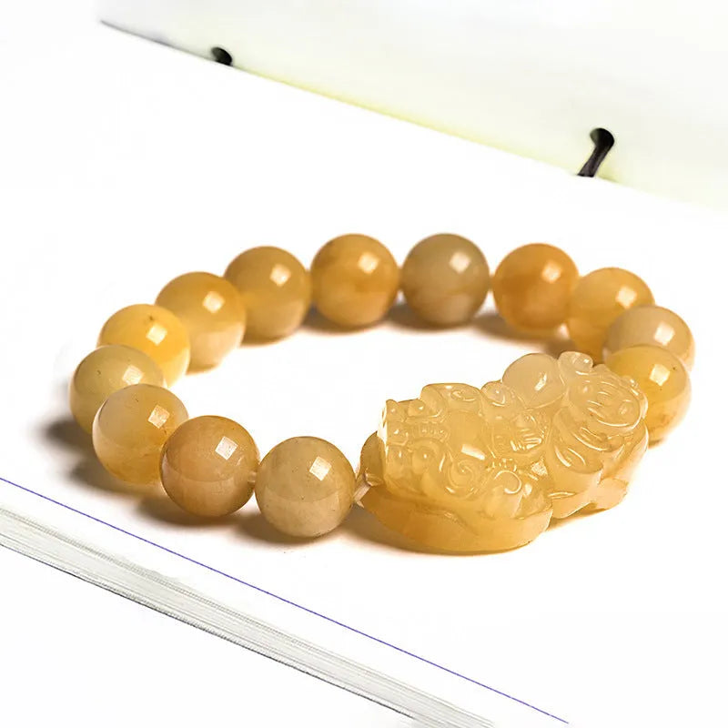 Carved Jinsi Jade money bracelet in golden thread colour showing large and small size options.