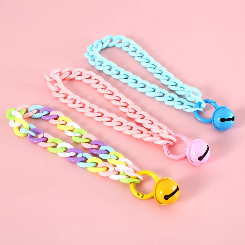 Plastic monochrome chain pet collar shown in chain blue, pink, and mixed colours for S and M sizes.