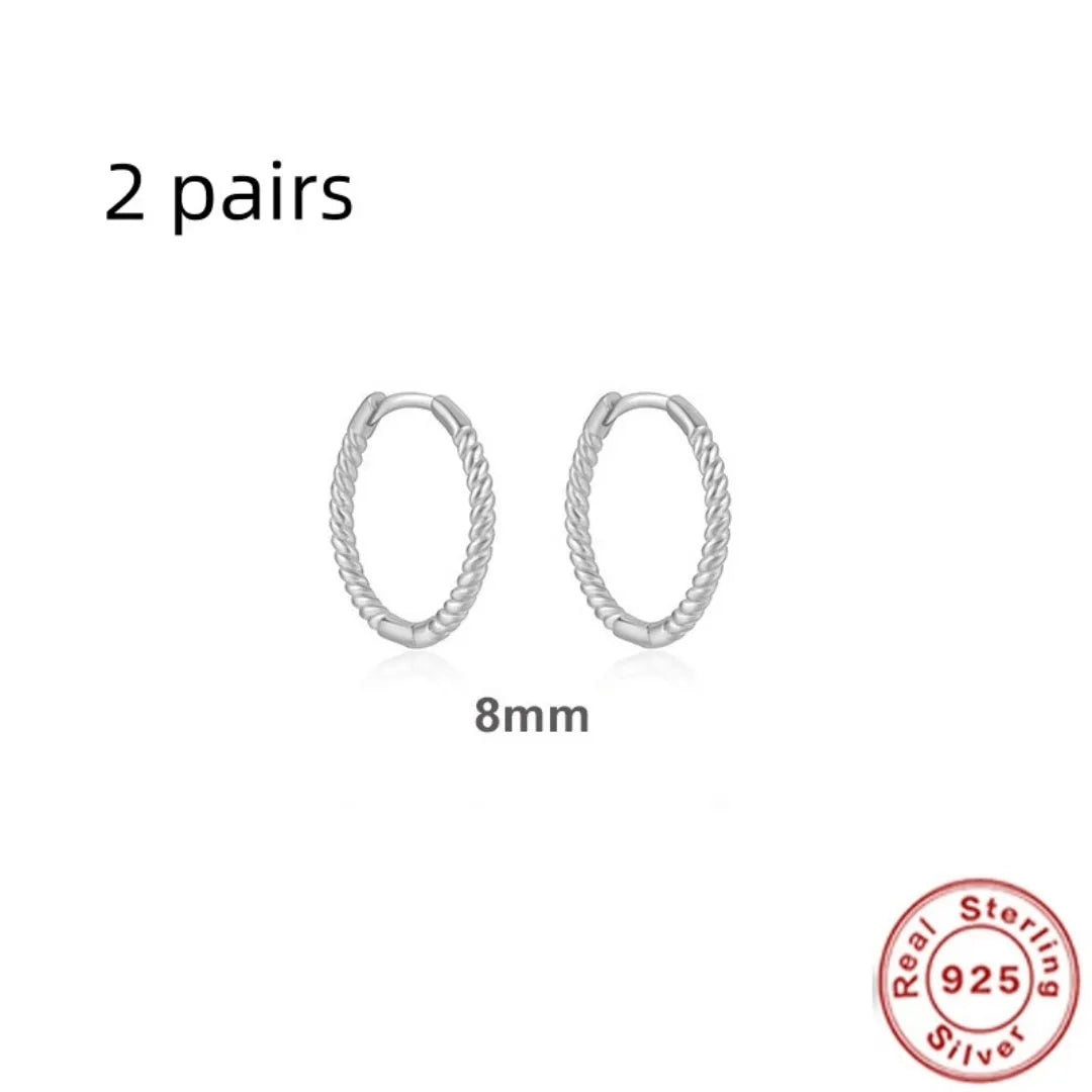 Sterling silver twisted ring earrings in geometric round design with gold or platinum finish