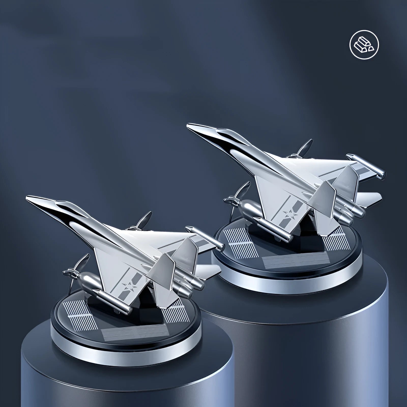 Silver solar powered rotating fighter aircraft perfume ornament on a table.