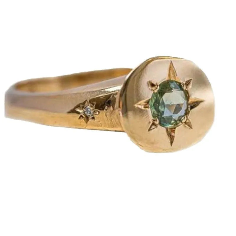 Gold oval ring with asterism detailing and adjustable opening on zinc alloy base