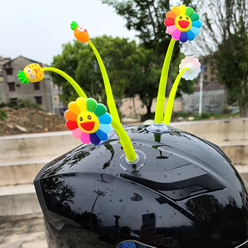 Yellow silicone sunflower decoration with a suction cup mount for helmets