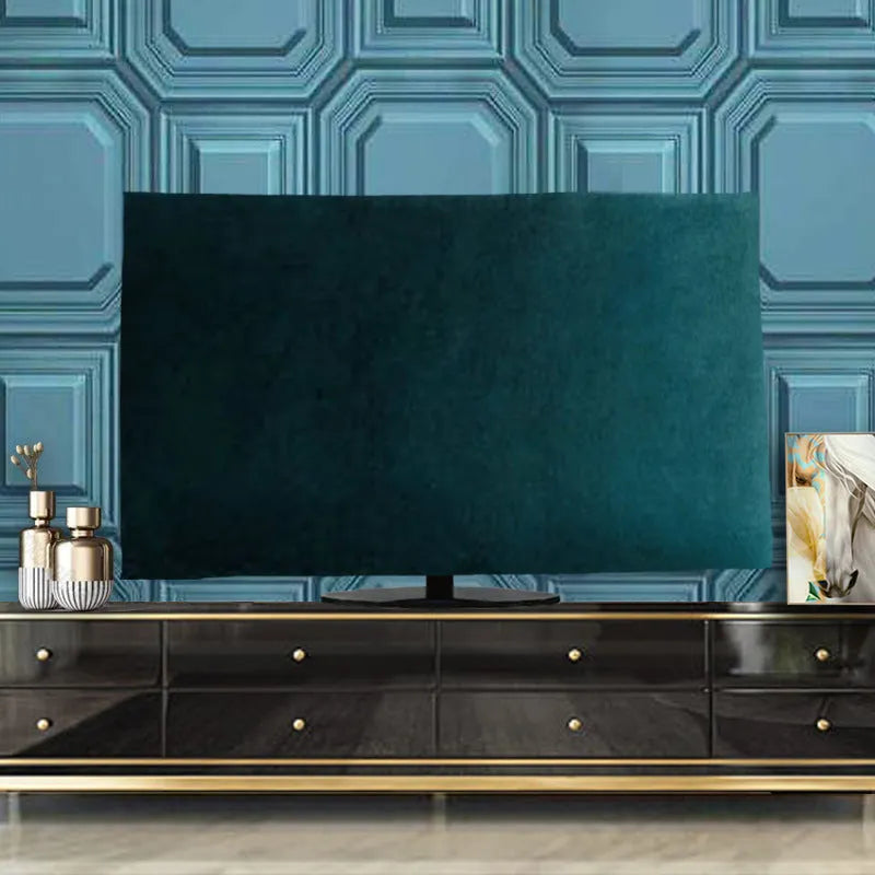 A pink velvet television cover draped over a flat-screen TV, showing its elasticated hem and soft fabric texture.