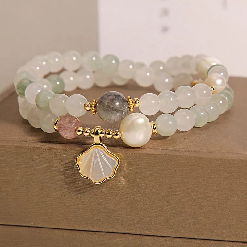 Women's crystal bracelet with an apricot leaf pendant and gold-plated gemstone accents in a green Tianshan jade colour.