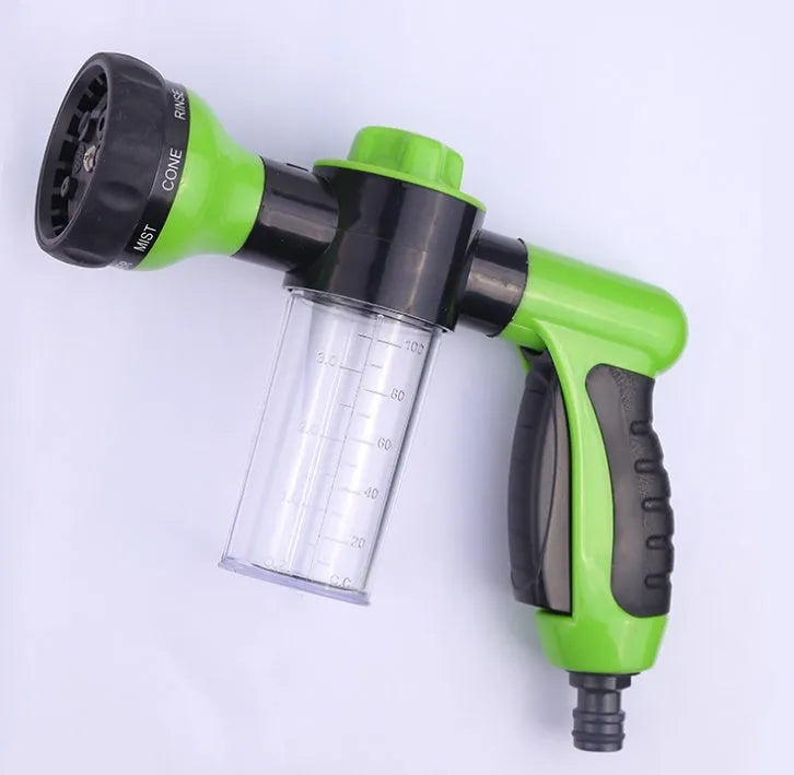 Green high pressure foam spray gun with adjustable nozzle for car washing and household cleaning.