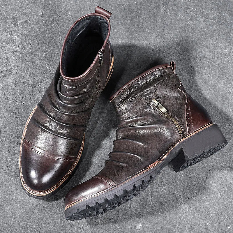 Black side zip Martin boots with round toe and medium heel on a plain background.