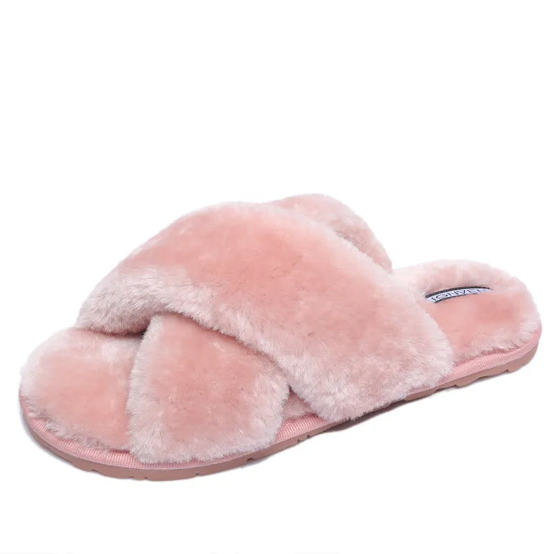Women's cross open-toe fur slippers in black showing non-slip sole pattern