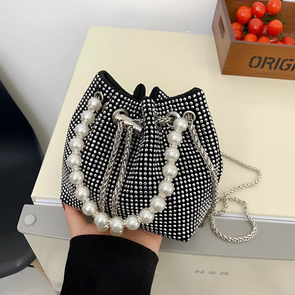Women's soft PU light diamond decorated crossbody shoulder bag with chain strap in bucket shape.