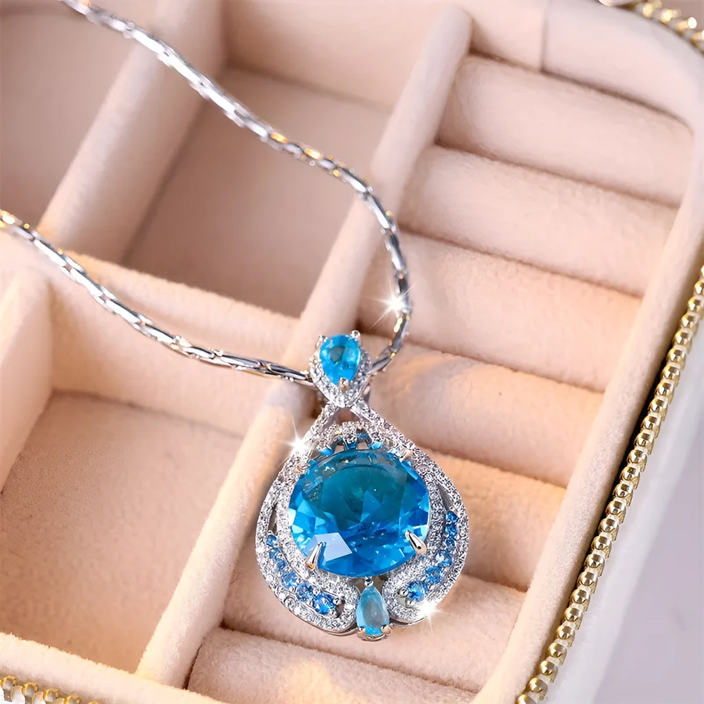 Women's geometric pendant necklace with blue crystal gemstone and water wave chain design