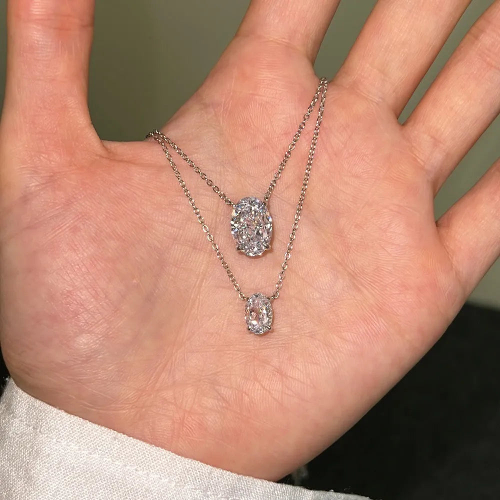 S925 sterling silver necklace with a geometric oval ice flower pendant in a choice of platinum or gold finish.